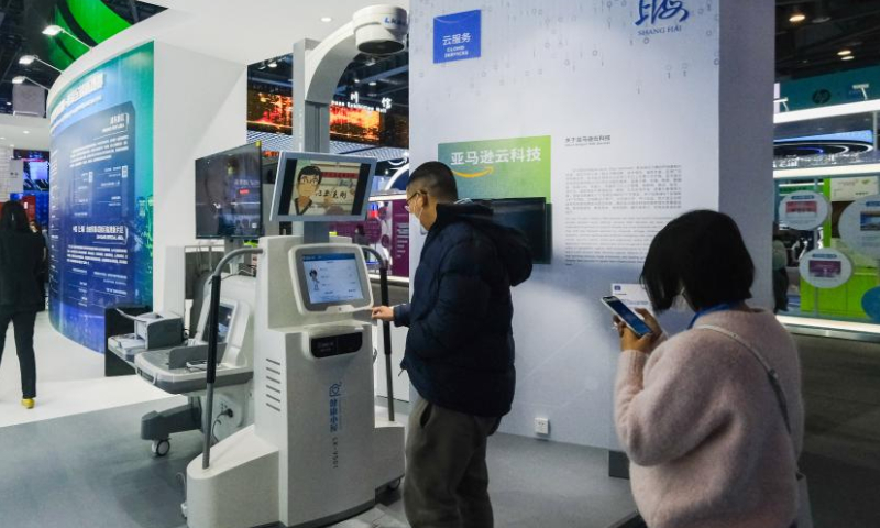 People visit the first Global Digital Trade Expo in Hangzhou, east China's Zhejiang Province, Dec. 11, 2022.The 4-day expo kicked off here on Sunday. Around 800 leading digital trade companies from China and abroad will showcase their new products and technologies during the expo. (Xinhua/Xu Yu)