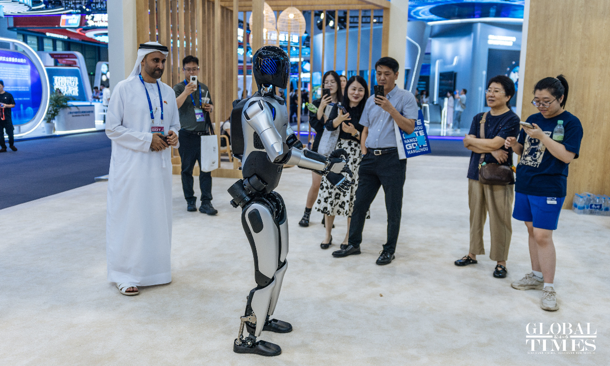 Participants watch a humanoid robot at the national pavilion of United Arab Emirates (UAE) at the 4th Global Digital Trade Expo (GDTE) in Hangzhou, East China's Zhejiang Province, on September 26, 2025. The expo is held from September 25 to 29. Photo: Li Hao/GT