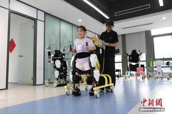 A patient conducts rehabilitation training with exoskeleton robots at a rehabilitation center in Hangzhou. (Photo: China News Service/Wu Junyi) HZ6.jpg